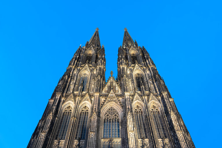 Cologne, Germany - Illuminated Western Facade of the Cologne Cathedral during Evening Blue Hour